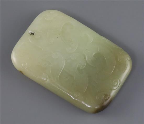 A Chinese pale celadon and brown jade plaque, 19th century, L.6.5cm